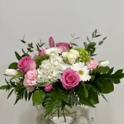 Pink and white mixed bouquet in a clear glass vase