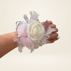 Hand corsage with white and pale pink roses and ribbon accents