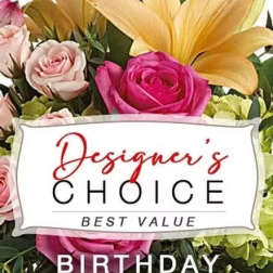 Bouquet of pink roses and yellow lilies with a birthday sign