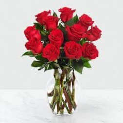 Bouquet of red roses in a clear glass vase