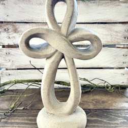 Stone knot sculpture on a wooden surface