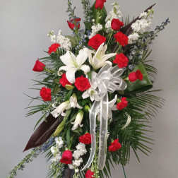 Red and white floral standing spray with lilies and roses