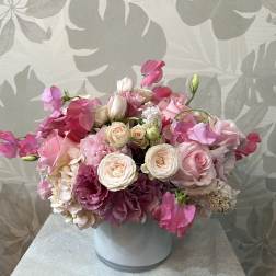 Pink and white bouquet in a white vase