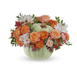 Pumpkin-shaped vase with orange and white flowers