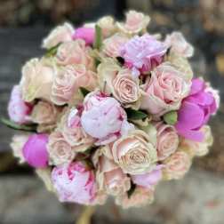 Bouquet of pale pink roses and pink peonies