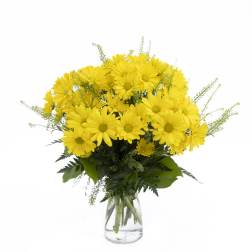 Yellow daisy bouquet in a clear glass vase