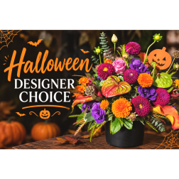 Halloween flower arrangement in a black pot with orange and purple blooms