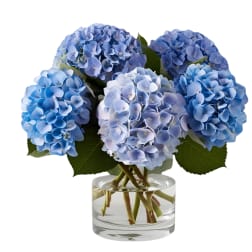 Blue hydrangea bouquet in a clear glass vase
