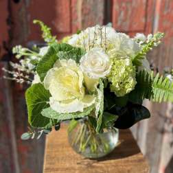 White floral bouquet in a clear glass vase