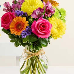Colorful mixed bouquet in a clear glass vase