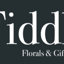 The Fiddly Fig Florals & Gifts logo on a dark background