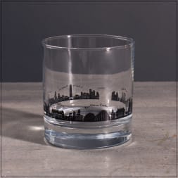 Clear glass tumbler with a black city skyline design