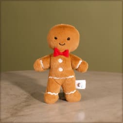 Gingerbread man plush toy with a red bow tie
