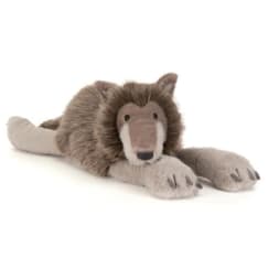 Plush lion toy lying down on a white background