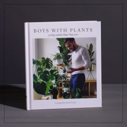 A hardcover book titled Boys With Plants standing upright