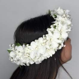 White floral crown worn on a person's head