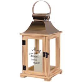 Wooden memorial lantern with a candle inside