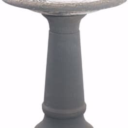 Gray stone birdbath pedestal on a white background