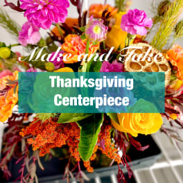 Colorful floral centerpiece with pink, orange, and yellow blooms