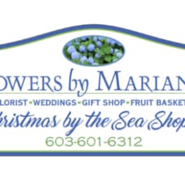 Floral shop sign reading Flowers by Marianne and Christmas by the Sea Shoppe