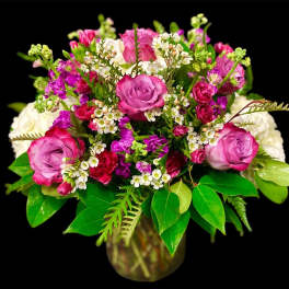 Bouquet of pink and white roses in a glass vase