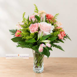 Pink and peach mixed bouquet in a clear glass vase