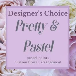 Pastel roses and white flowers behind a pink sign reading Designer's Choice Pretty & Pastel