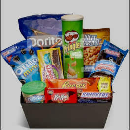 Gift basket filled with snack bags, candy bars, and a Pringles can