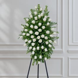 White rose standing spray on a black easel