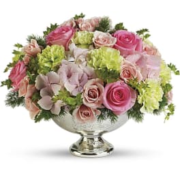 Pink and peach roses in a silver pedestal bowl