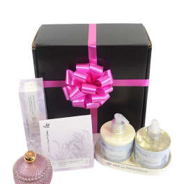 Gift box with pink ribbon and assorted bath products