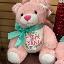 Pink teddy bear with a teal ribbon and "Love You Nana" on its belly
