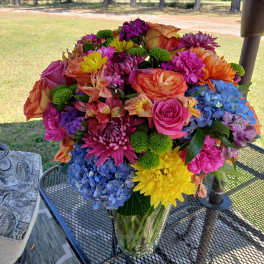 Colorful mixed bouquet in a clear glass vase