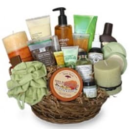Basket of assorted bath and body products with candles