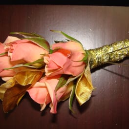 Pink rose boutonniere with gold ribbon wrap