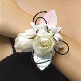 White rose and lily wrist corsage with black loops and pink accents