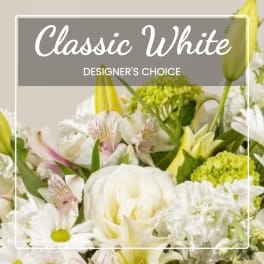 White floral bouquet with lilies, daisies, and green accents