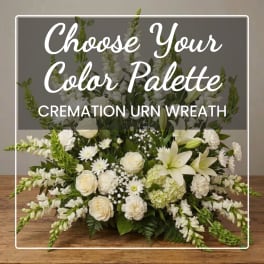 White floral cremation urn wreath with lilies, roses, and daisies