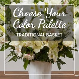 White floral basket arrangement in a white container with overlaid text