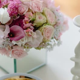 Pink and white rose bouquet with a purple calla lily