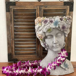 Stone bust planter with purple orchid garland and butterfly accents