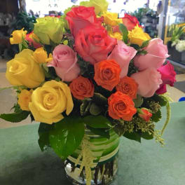 Colorful bouquet of roses in a glass vase