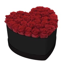 Heart-shaped box filled with red roses