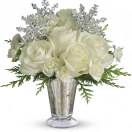 White roses and carnations in a silver vase with glittery accents