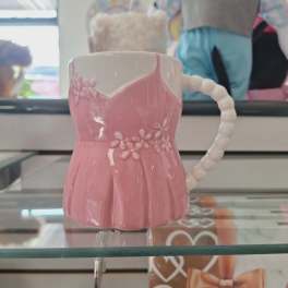 Pink ceramic mug with a floral dress shape and white handle