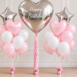 Pink and white birthday balloon arrangement with heart and star balloons