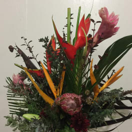 Tropical bouquet with red and orange heliconia and pink ginger flowers