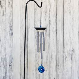 Hanging metal wind chime with blue accents