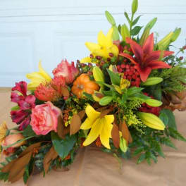 Colorful floral arrangement with lilies and roses on a table