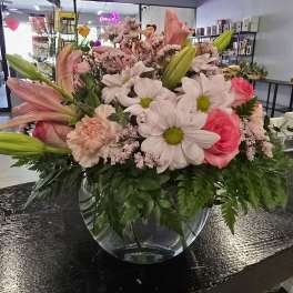 Pink and white mixed bouquet in a clear glass vase